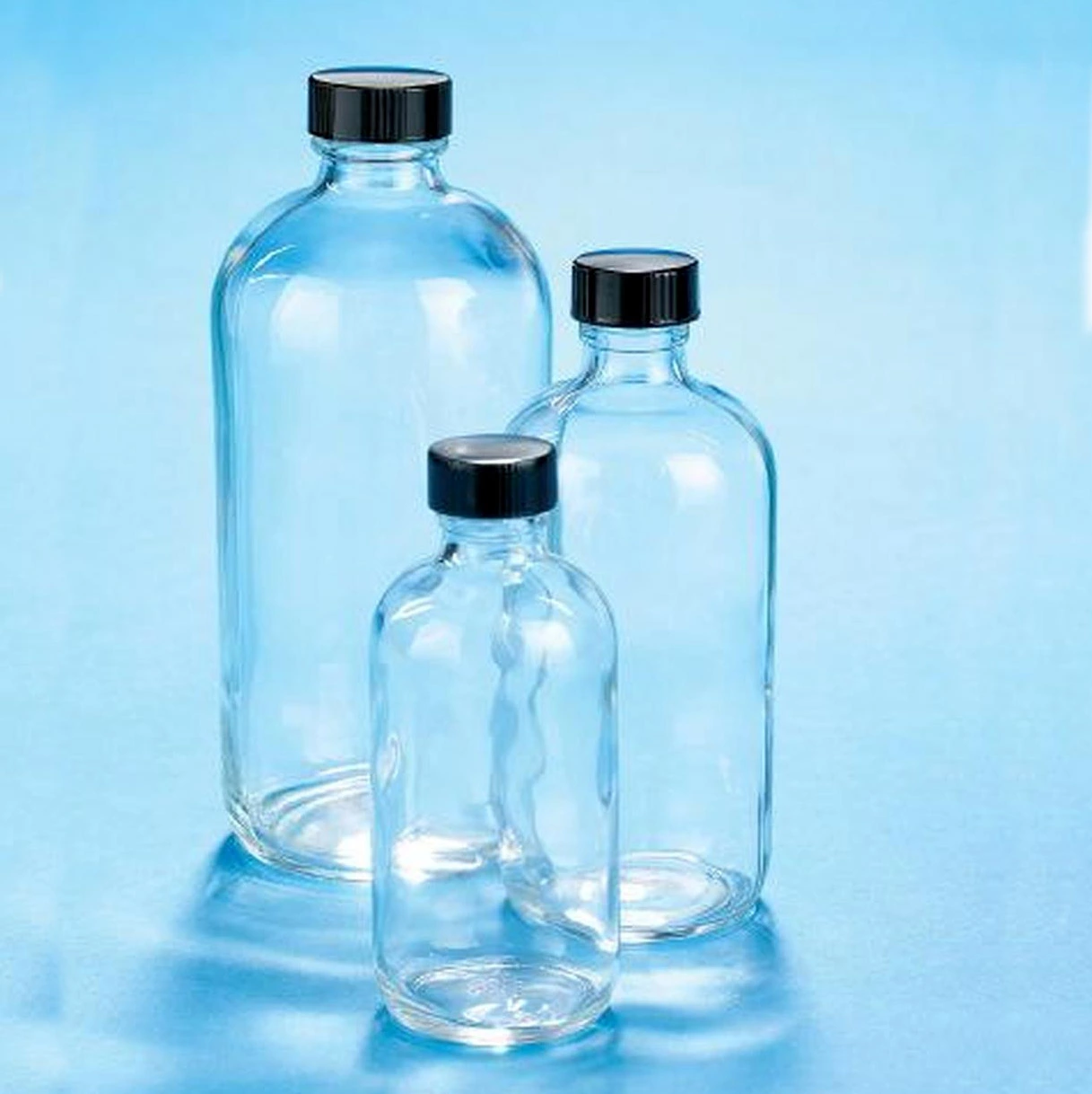 Manufacture Various Sizes 0.5oz 1oz 2oz 4oz 8oz 16oz 32oz Clear Amber Glass Round Boston Bottles for Shampoo Bath Gel