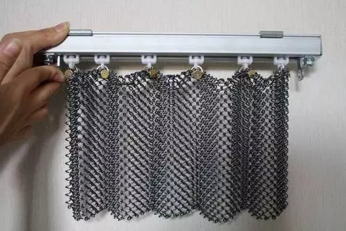 Decorative metal mesh coil drapery in curtain